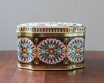 Vintage floral caramel tin.