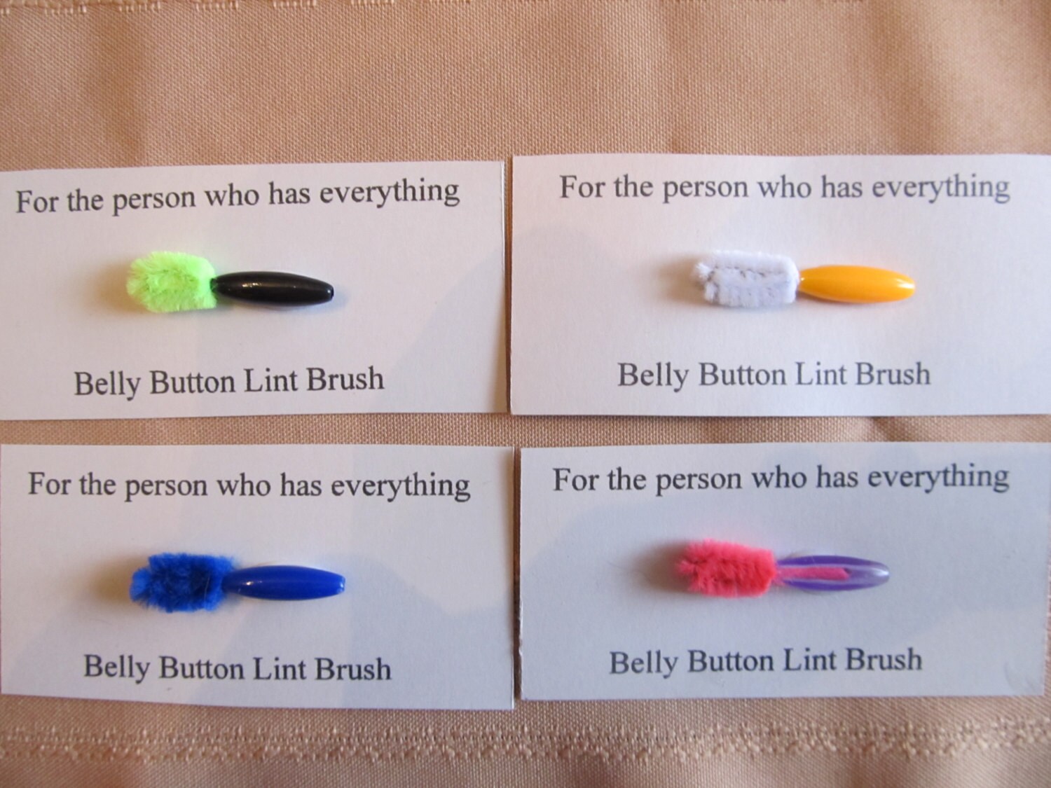 4 belly button lint brushes for the person who has