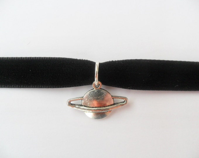 Black velvet choker necklace with saturn planet pendant and a width of 3/8”inch.