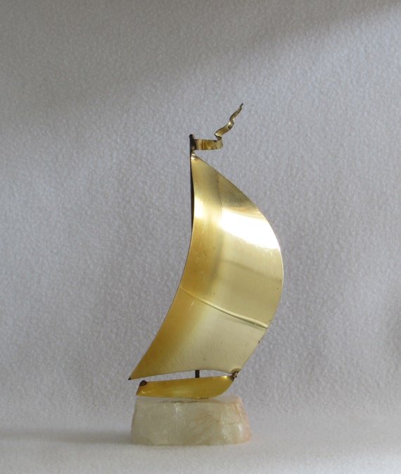 brass sailboat signed