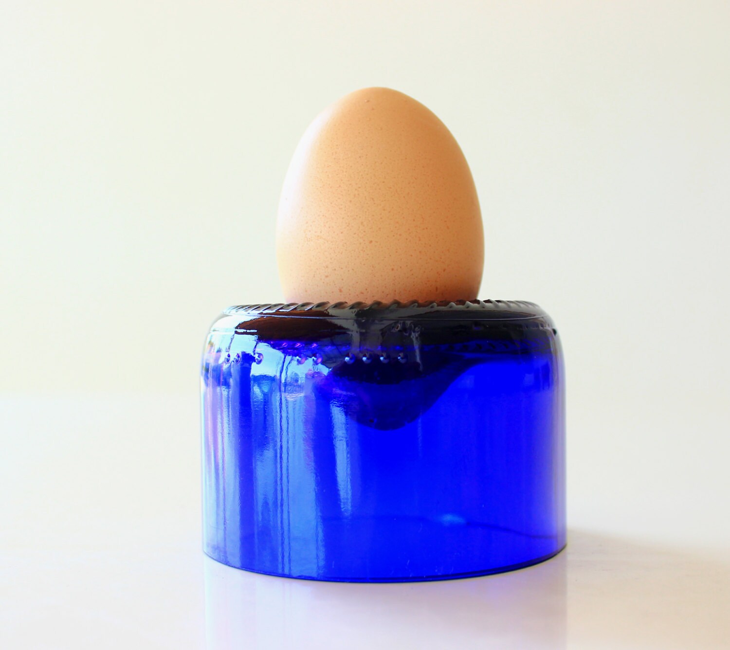 Egg cup holder upcycled from cut wine bottle in blue by undun