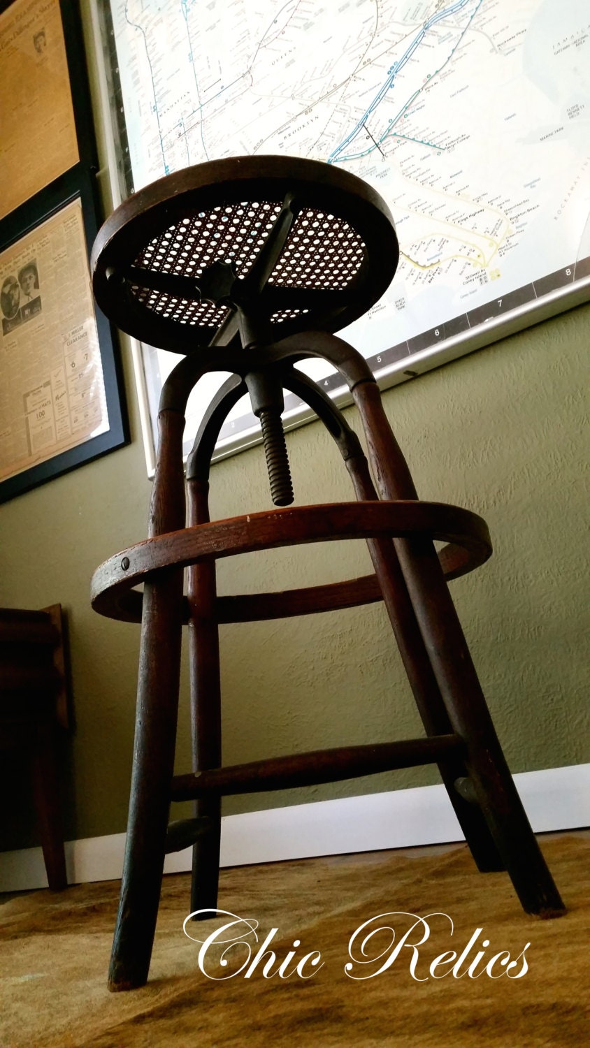 Antique Wakefield Co. Buffalo NY Industrial Iron and Oak Swivel Stool with Original Cane Seat