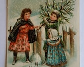 Trio of Children Bringing Home Christmas  Tree Vintage German Postcard