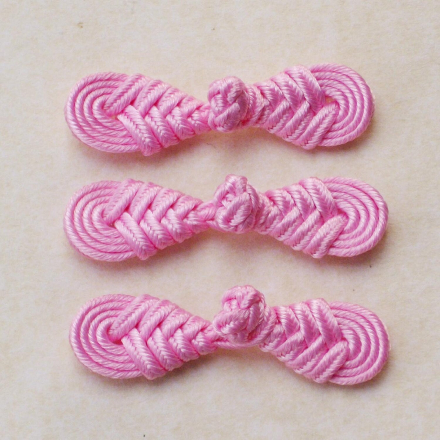 Pink frog closure. Round knot small. Set of 3