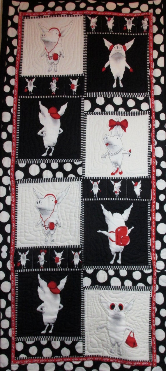 olivia-the-pig-patchwork-quilt-red-black-and-white-wall