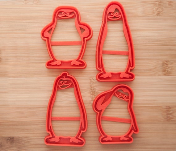 Penguins of Madagascar .  Cookie cutters. Gingerbread and cookies.