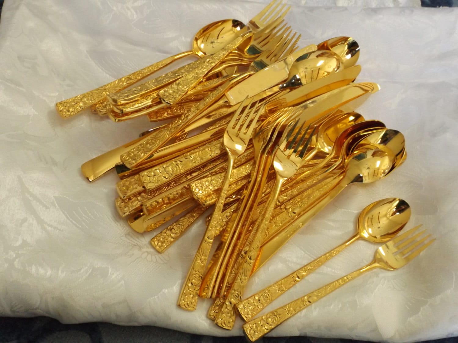 Japanese gold plated stainless set 49 flatware. Tropic Garden
