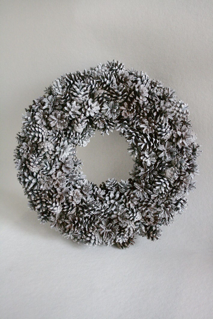 White wreath full of cones