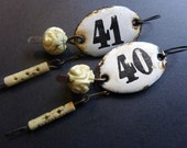 Order and Harmony. Rustic assemblage art earrings with white enameled plaques. 40/41