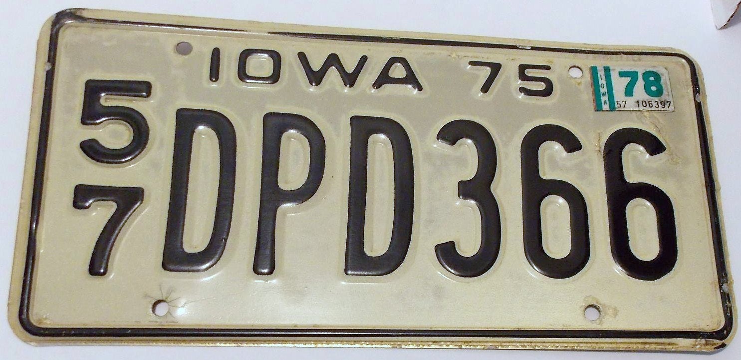 1975 Iowa License Plate White And Black Old by ArtByThePond