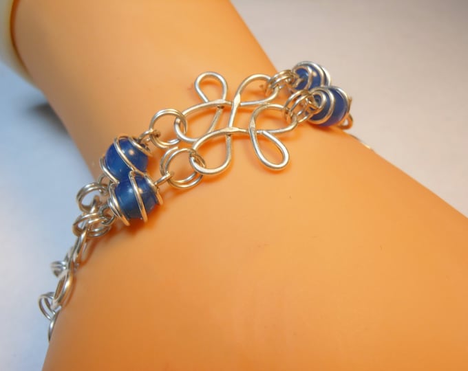 Sterling silver filigree bracelet with blue agate caged beads all handmade with hammered filigree components