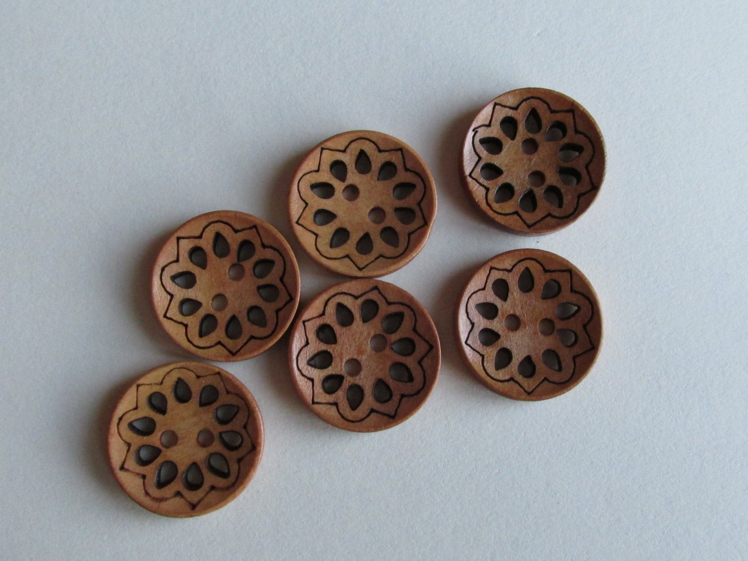 Carved wooden buttons 2.5cms light natural colour