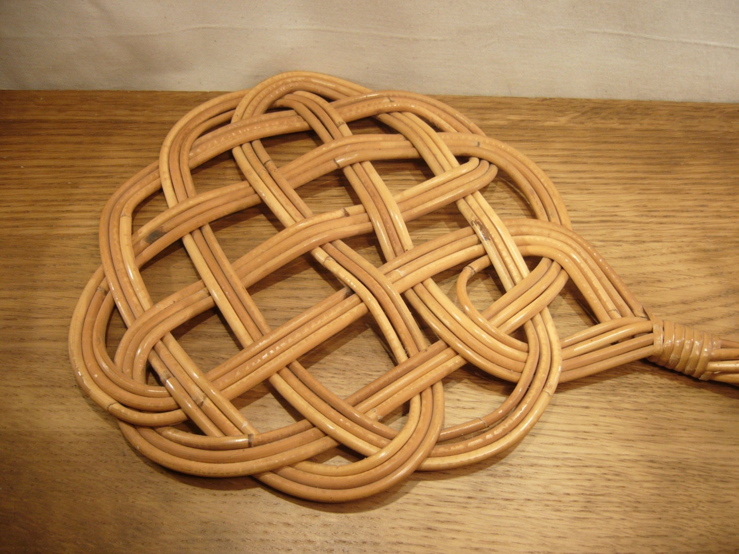 Vintage woven cane carpet beater with metal by FieldfareVintage