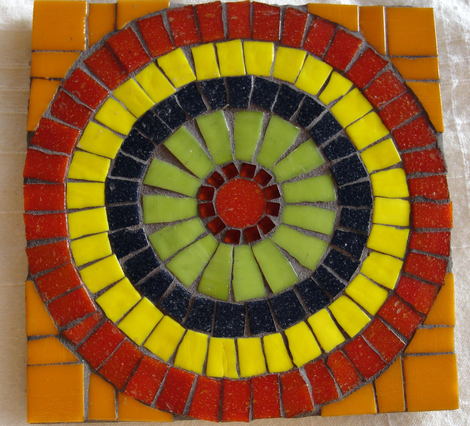 Circular fiesta style mosaic trivet by MagicValleyMosaics on Etsy