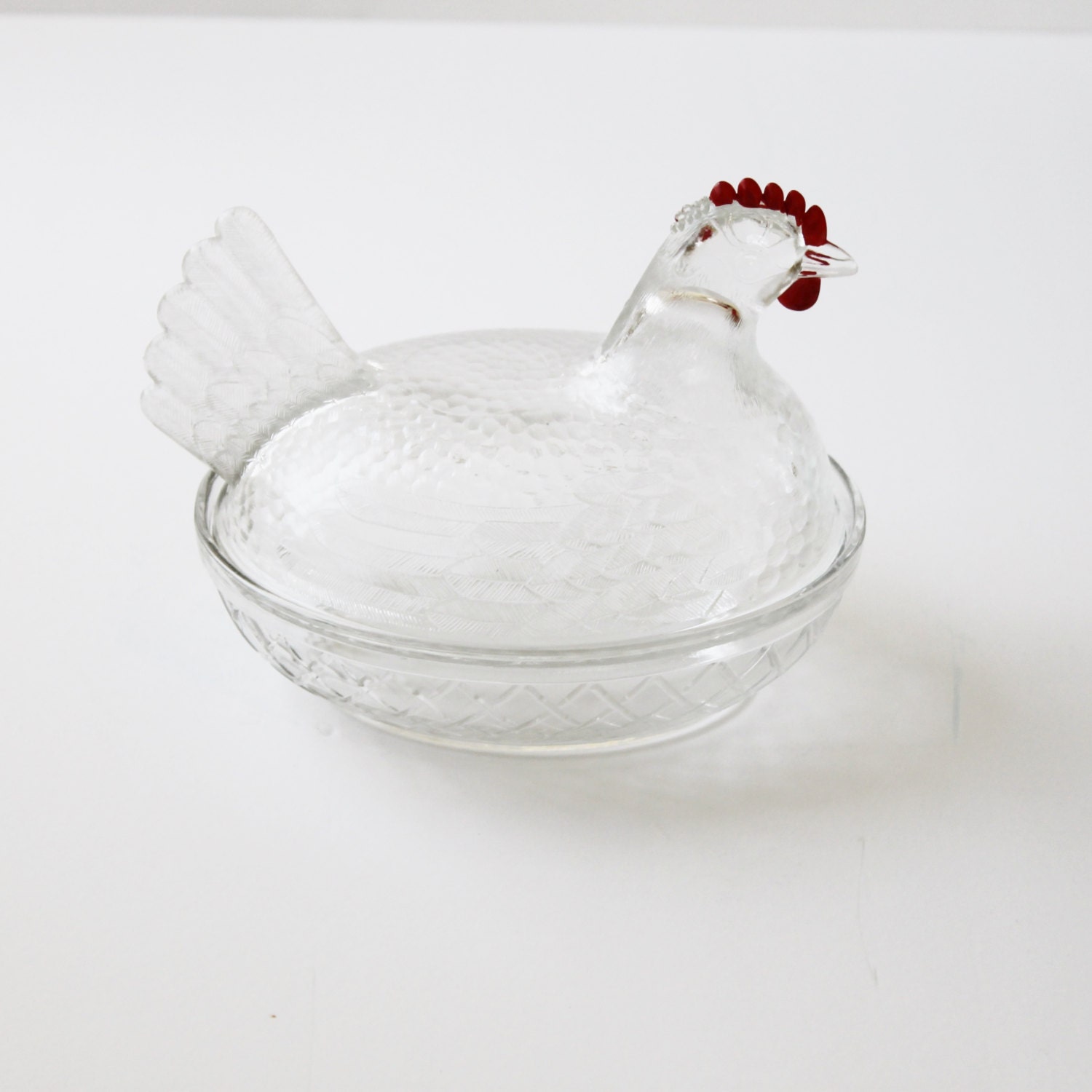 Vintage clear glass hen on nest with red paint on comb and