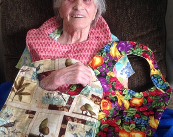 Adult bibs for seniors .Two bibs, reversible.12 inches from lower neck neck to bottom, generously sized.