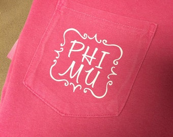 Phi Mu Quatrefoil Shirt offered on a variety of shirt styles!