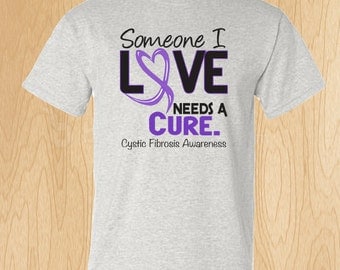 Cystic Fibrosis Awareness "Someone I Love Needs A Cure" T-shirt **BULK LISTING**
