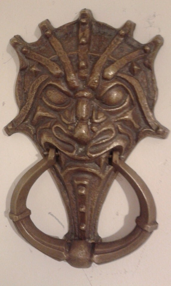 Unique cast brass door knocker mythical creature