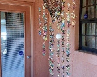 Origami Crane and Antique Fishing Net with Sea Shells