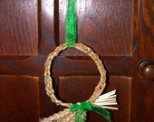 Sweet little plaited straw Christmas Wreath decoration with green bow
