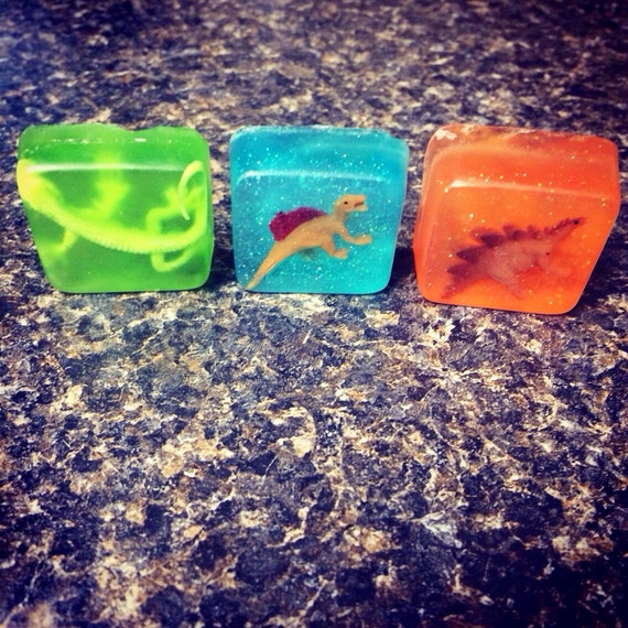 1.25 inch square mini soap orange scent with toy dinosaur or lizard inside!
