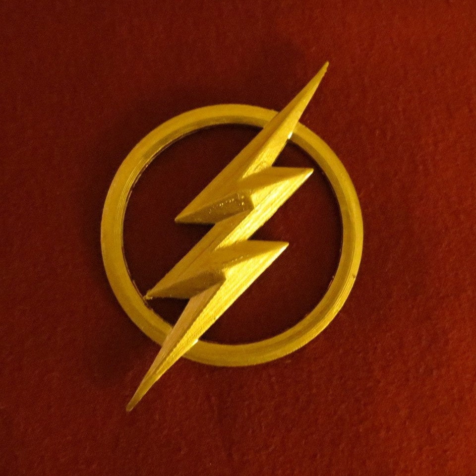 Full-sized Flash costume 3D printed lightning bolt insignia.