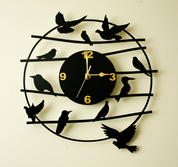 Laser cut acrylic wall clock.