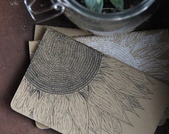 Small moleskine sketchbook with sunflower