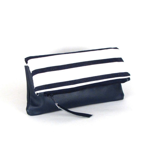 navy blue and white clutch bag