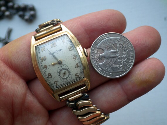 square gold bulova watch