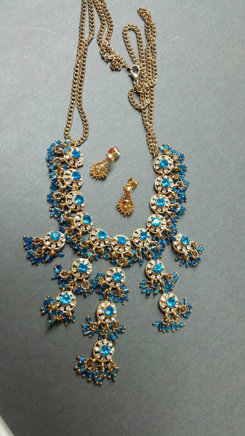 Pretty Teal Ethnic Necklace and Gold tone Earrings Party Wear – Haute Juice