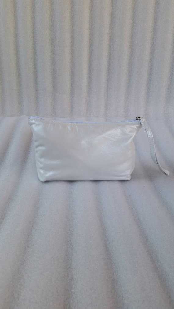 white wristlet clutch bag