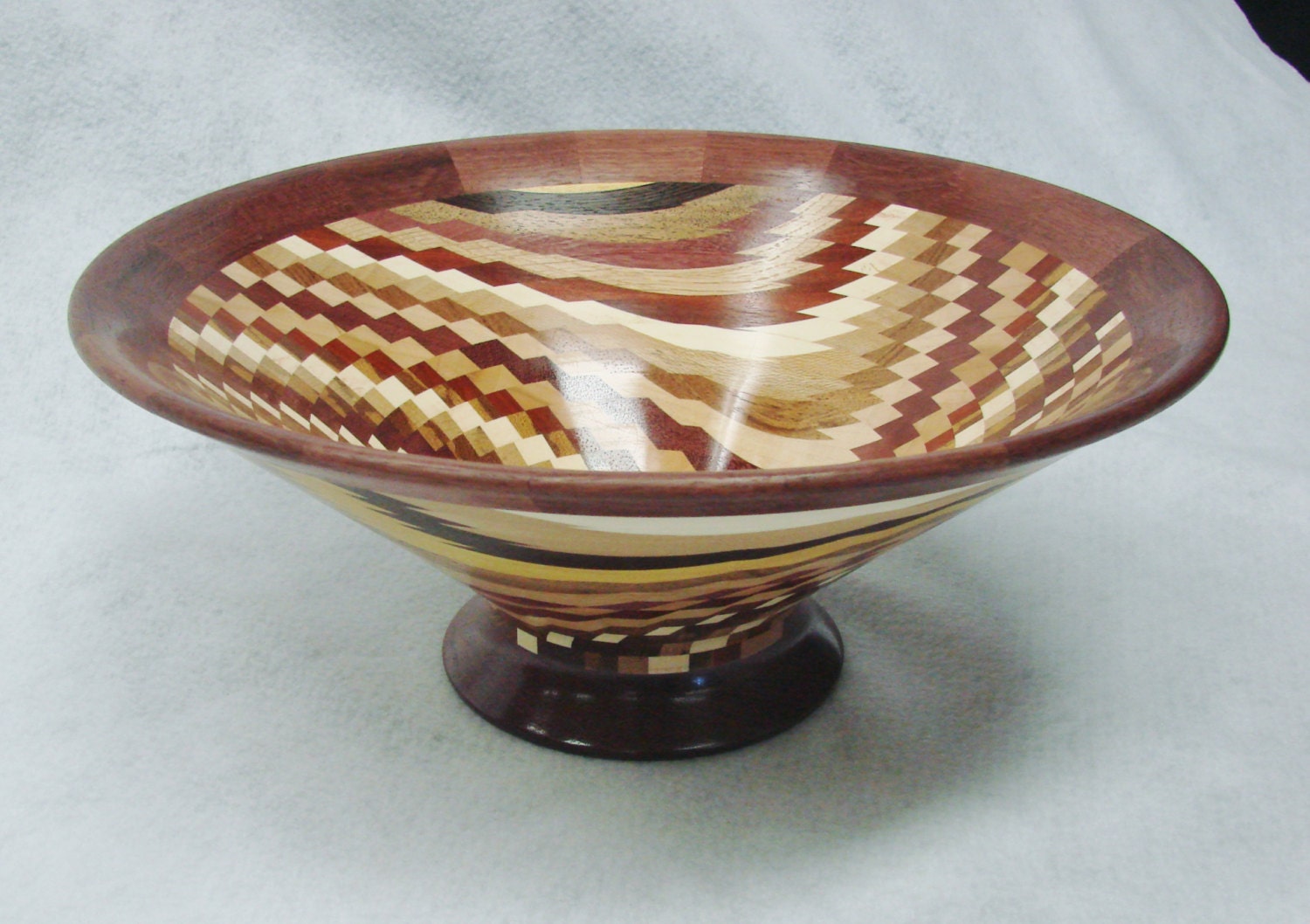 Swirling segmented turned wood bowl