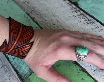 Unisex leather "Handcut Feather" cuff with hand drawn pyrographic detailing. Unisex leather cuff. Leather cuff.
