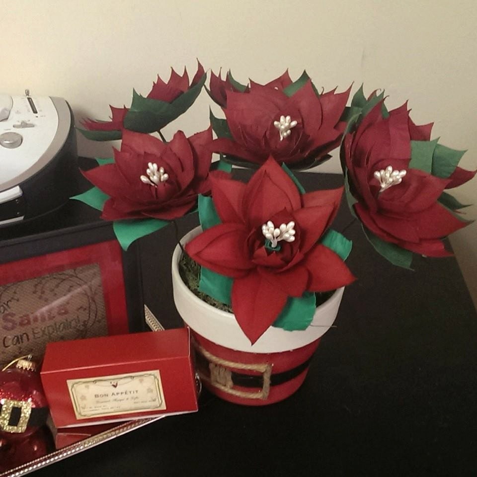 Handmade paper poinsettia's in a Santa pot. with gift wrapping and card,