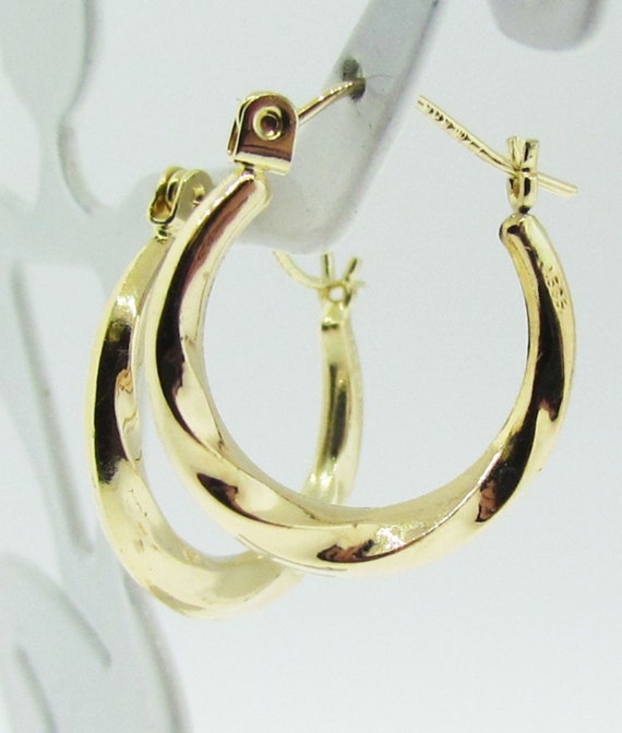 Yellow gold medium size hoop earrings.