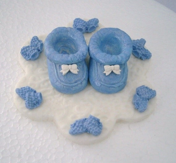 Edible baby shower cake topper with blue booties. Baby booties