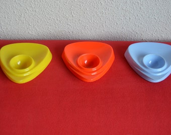 Three vintage plastic eggcups from Vitri in yellow, orange and light blue, fifties