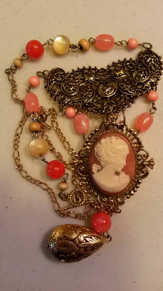 Cameo Locket, Vintage assemblage necklace. Coral vintage beds, Victorian Style, Steampunk.