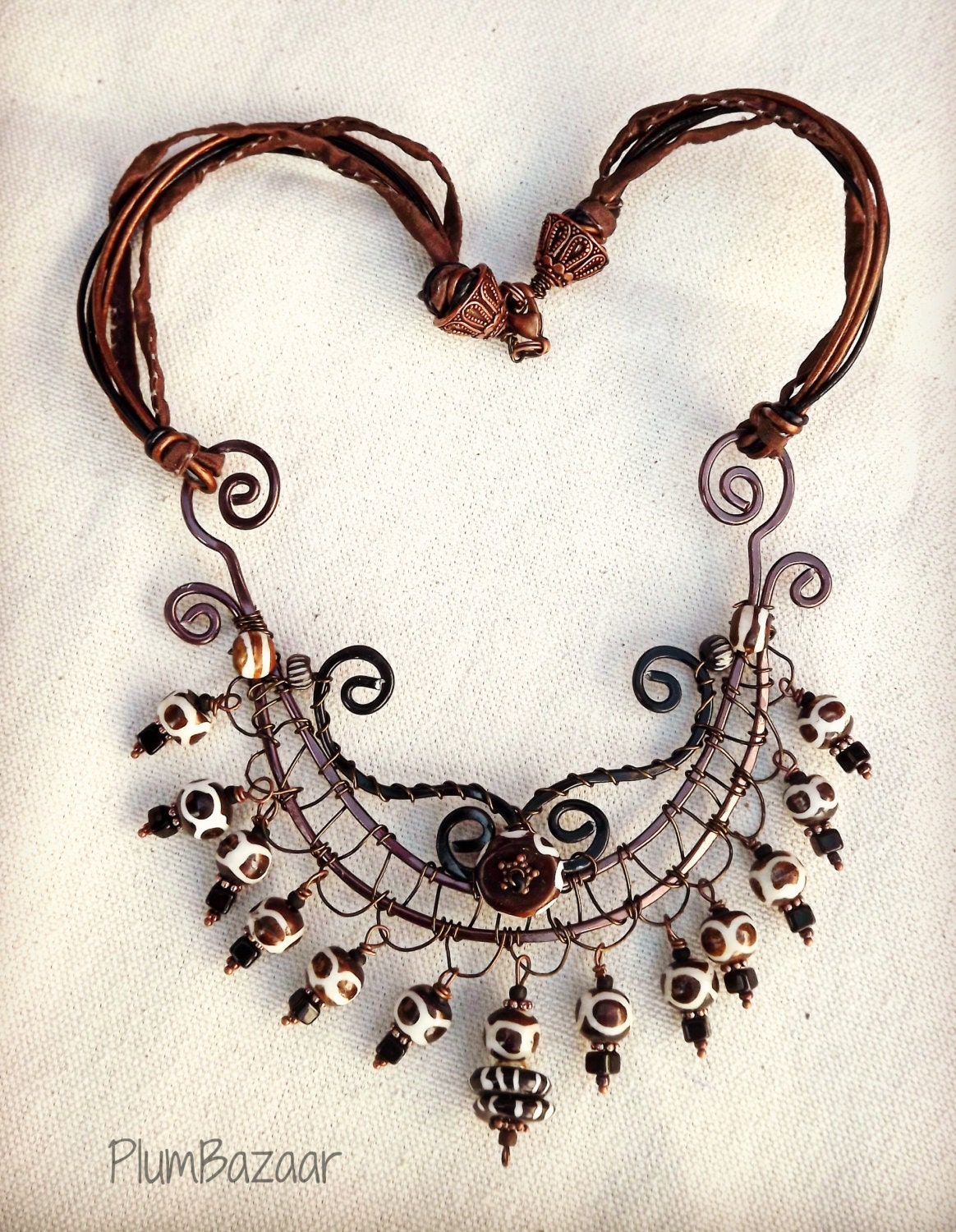 Wire wrapped bib necklace with leather and silk cords tribal