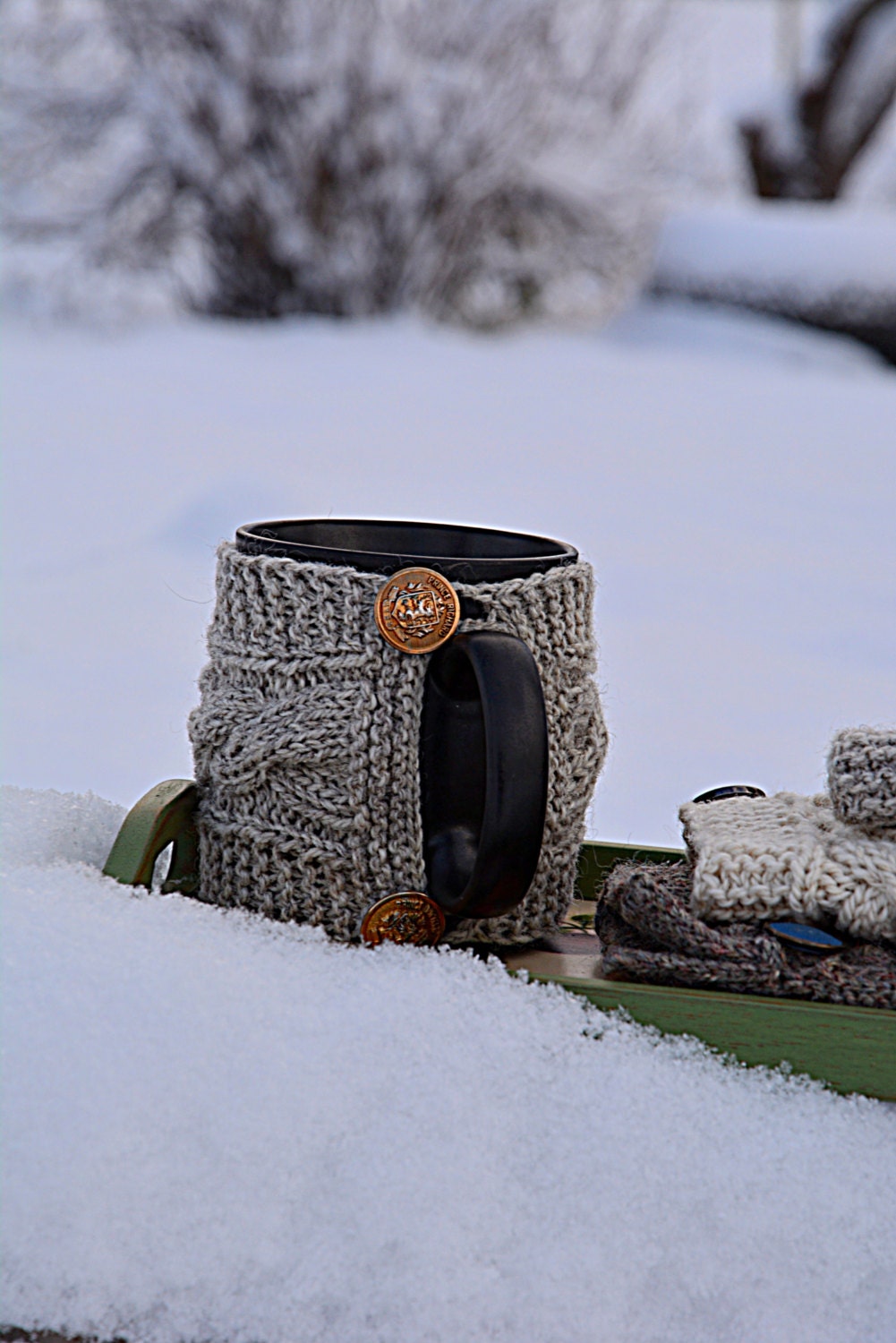 Knit coffee mug cozy with cable pattern. Grey cup cozy