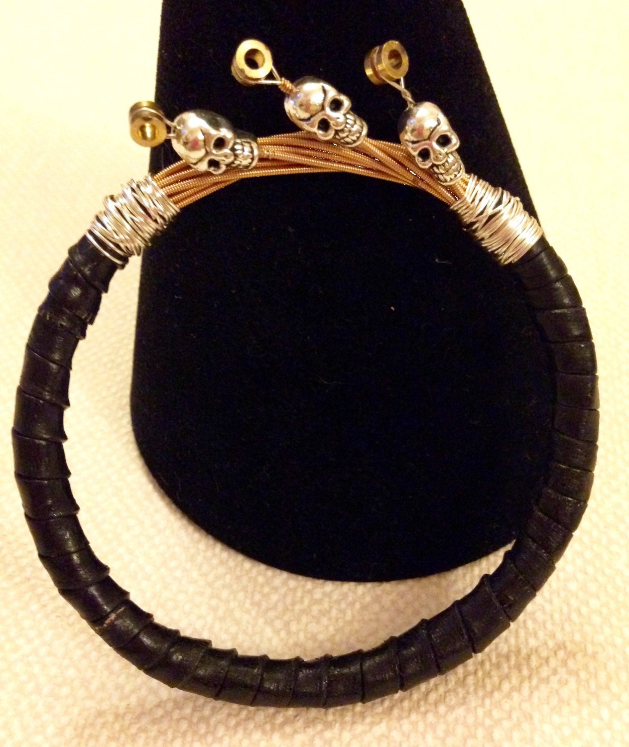Guitar String Bracelet With Leather & Skulls by AllAboutTheStrings