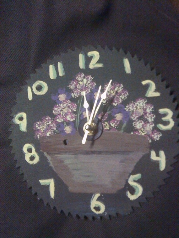 Hand painted saw blade clock by Poormargies on Etsy