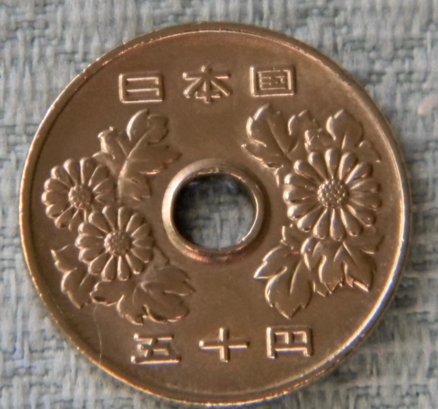 japanese coin with square hole