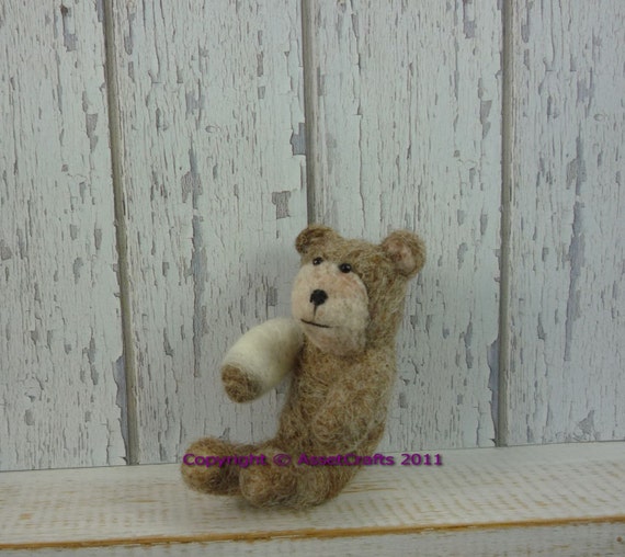 broken arm teddy bear