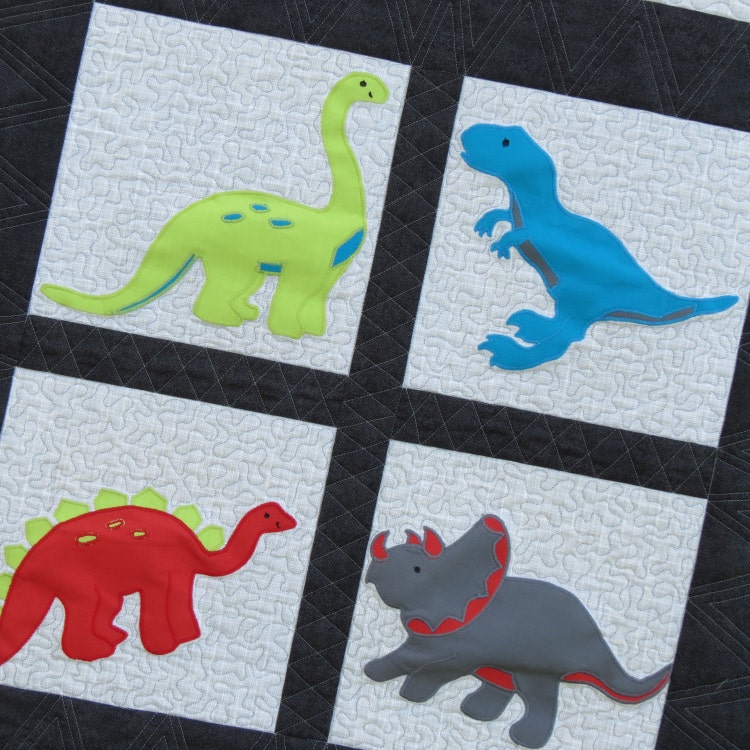 Personalized Baby Quilt with Appliqued Dinosaurs by SewYouLikeIt