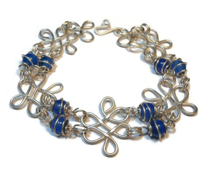 Sterling silver filigree bracelet with blue agate caged beads all handmade with hammered filigree components