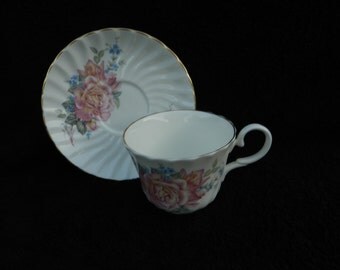 Vintage Tea Cup and Saucer: Hand decorated porcelain