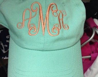 Mint hat with soroity letters or initials.